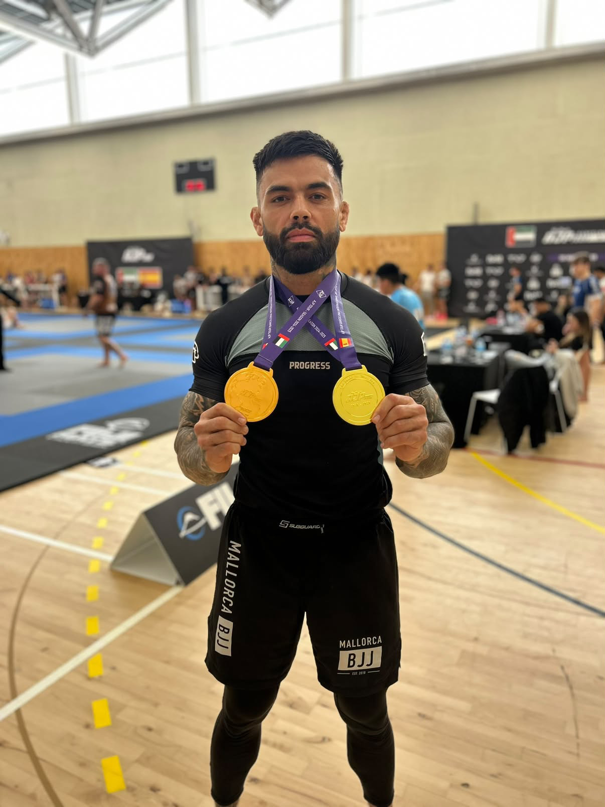 Kiki Plumb with Jiu-Jitsu gold medals